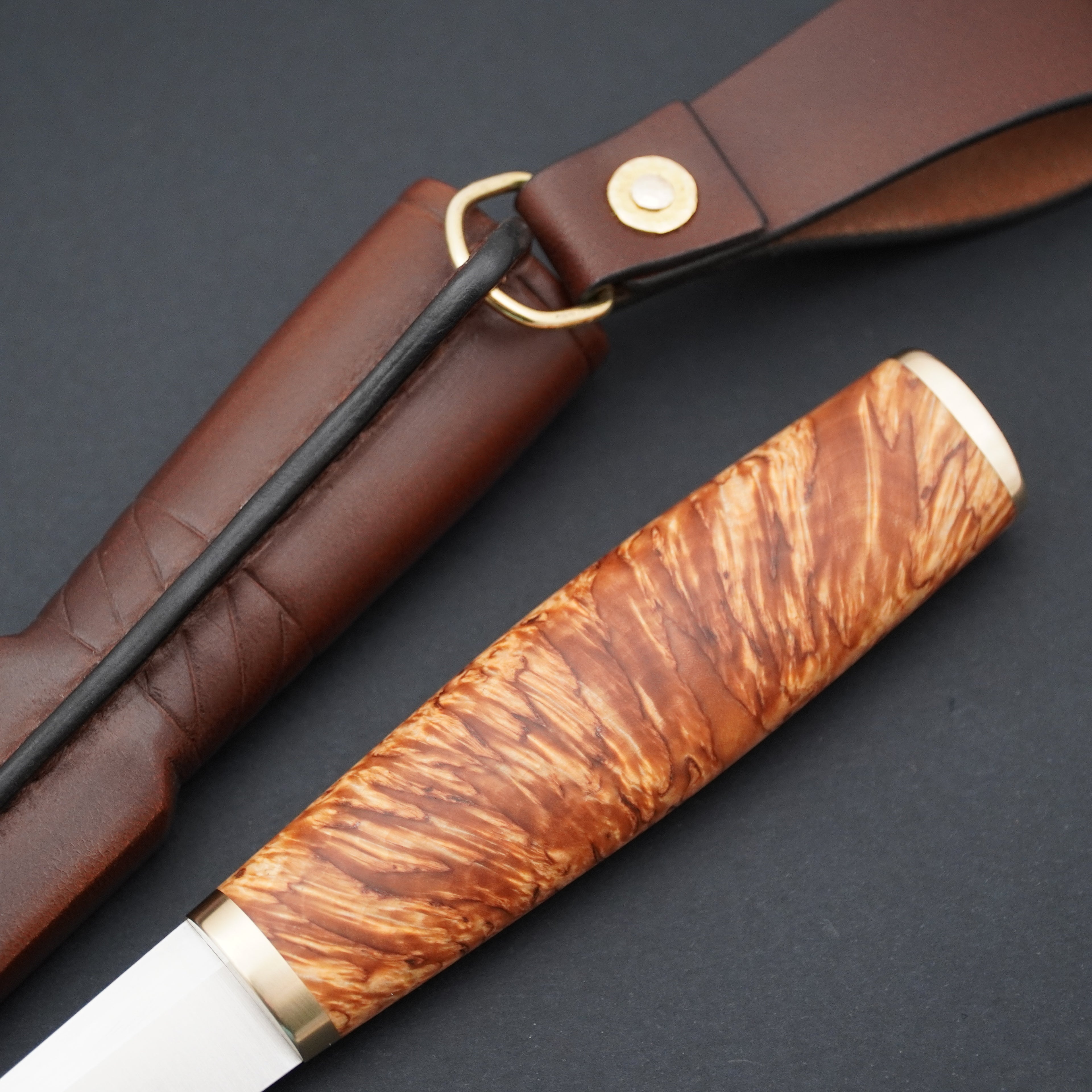 Puukko, Magnacut, stabilized X-cut curly birch