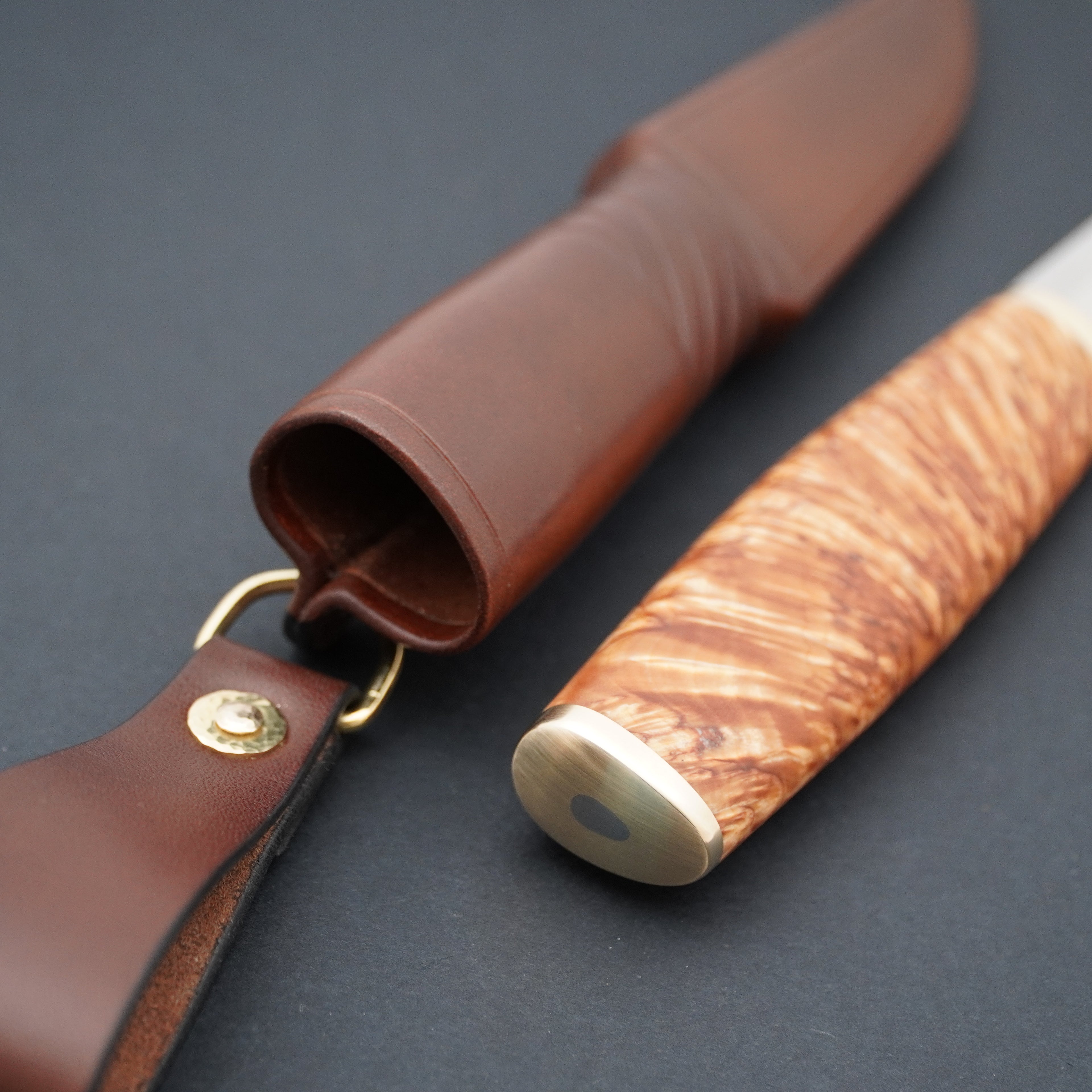 Puukko, Magnacut, stabilized X-cut curly birch