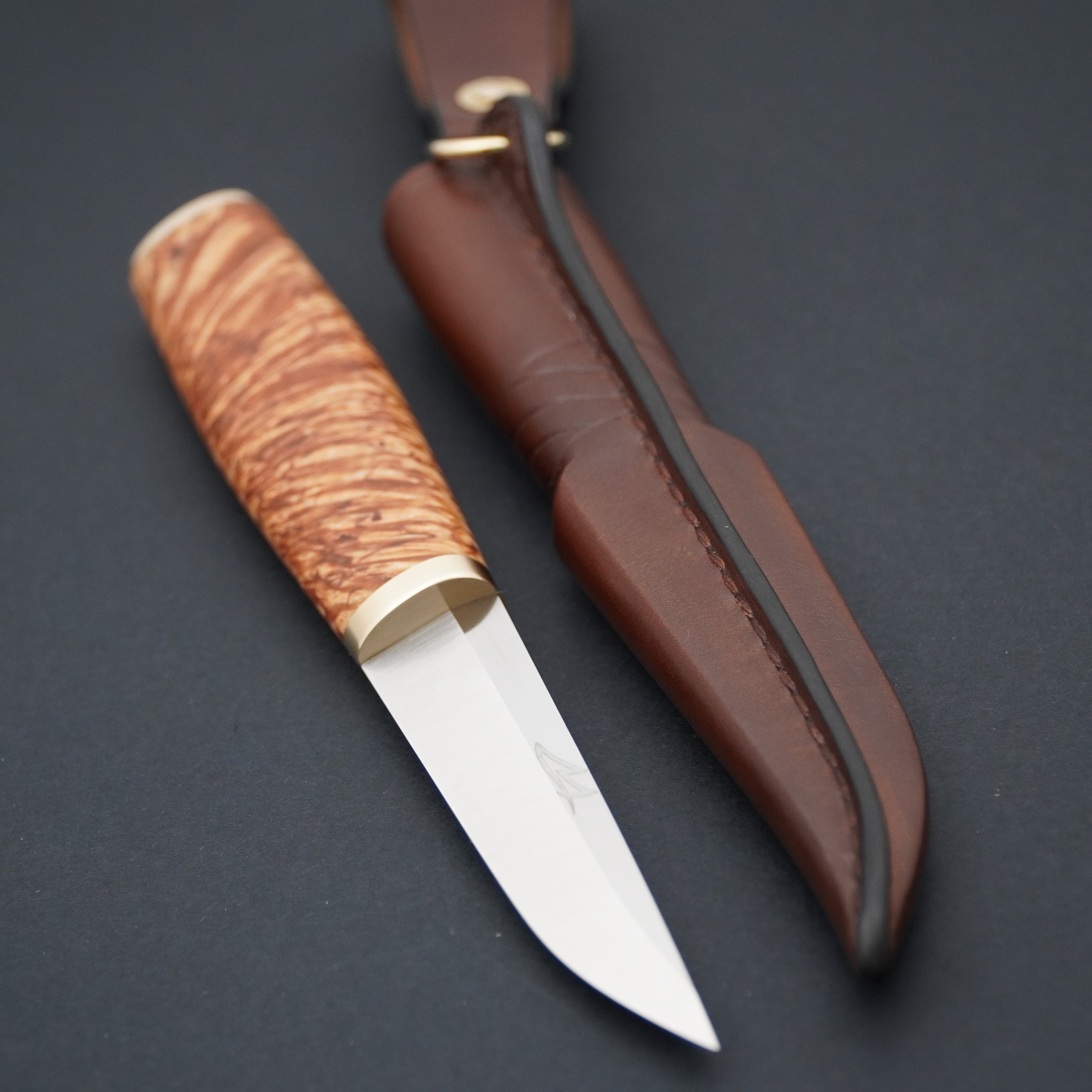 Puukko, Magnacut, stabilized X-cut curly birch